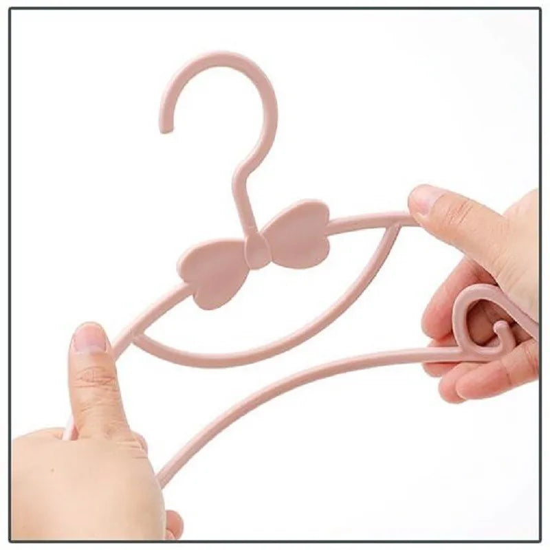 Perchas para ropa de bebé perchas de plástico portátiles para abrigos, toallas y bufandas, con diseño resistente al viento, ideales para organizar la ropa infantil.